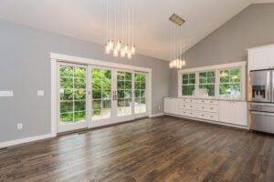 A Large Wood Panel Space With French Doors