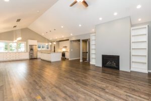 A Large Kitchen and Living Space With White Door Frames