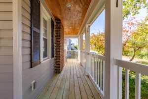 A Pathway of a House With White Railing